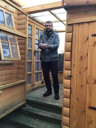 Lewis Mcauly inside his loft avairy