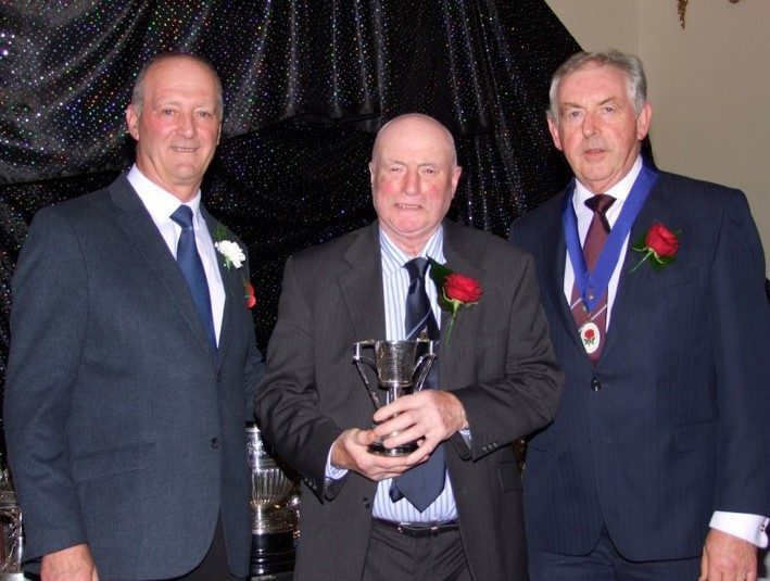 Bobby Brandon receiving his trophies from Chris Sutton and Stephen Beardmore 23 11 21