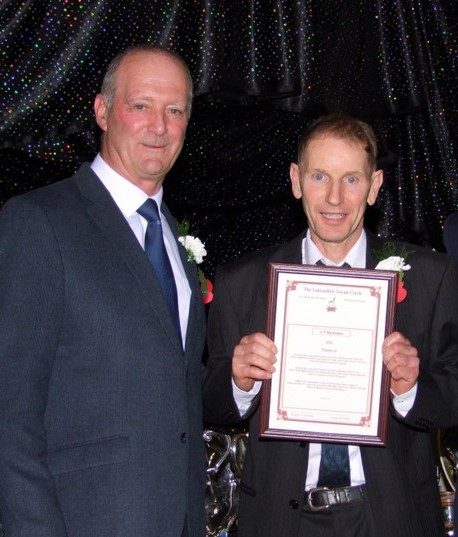 Paul Bolton receiving his Award from Chris Sutton. 23 11 21