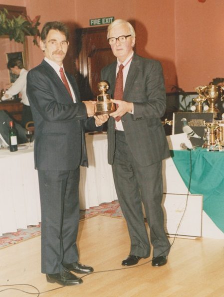 Jock Duthie receiving the Gold Globe see text