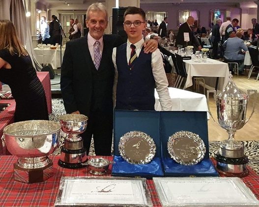 Dennis grandson with trophies won at SNFC Dinner 01 07 24