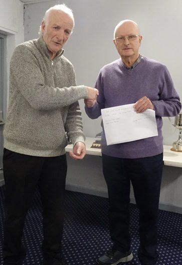 Alan Houldsworth recieveng his prize money from Paul Adams. 17 12 24a