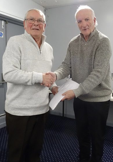 Mick Stone recieveng his prize money from Paul Adames. 17 12 24a