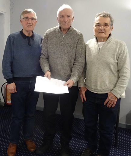 Shenton Brothers Ron Norman recieving their prize money from Paul Adams. 17 12 24a