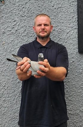 Michael Monaghan of OM Monaghan holding their Section D Winner from Cloughmartin 10 09 25Z