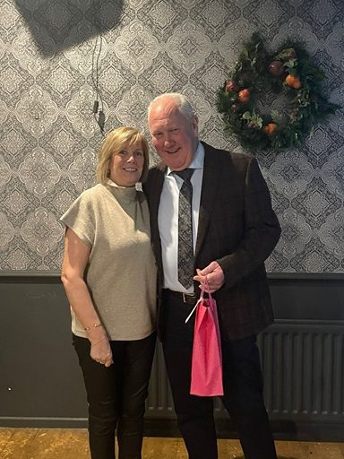 Joan McGrugan presenting Arnold with a gift for presenting the prizes 26 02 26a